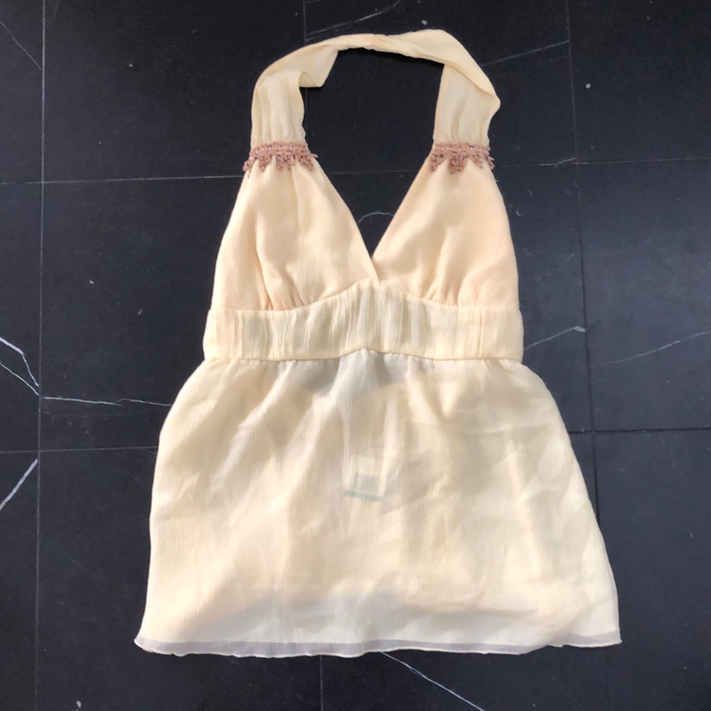 Yellow halter top. New with tags. Size Large.